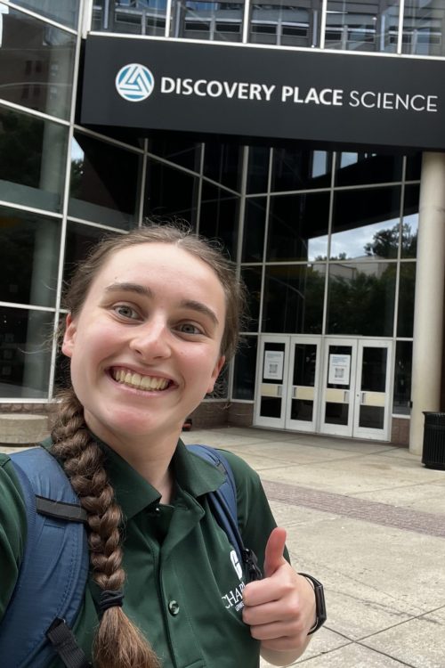 A scholar outside of Discovery Place Science in Charlotte.