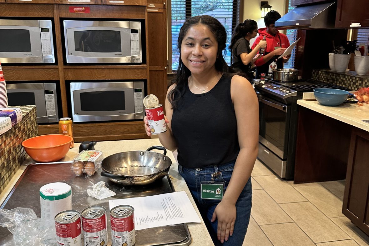 A scholar preparing a meal at the Ronald McDonald House.