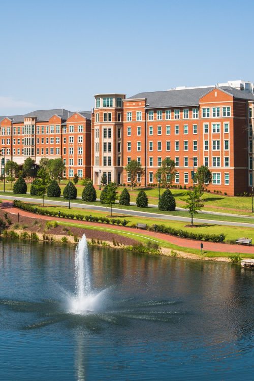 Levine Hall from Rowe Arts building showing lake and fountain.