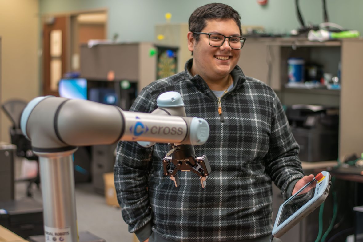 A scholar in a lab excited about conducting research.
